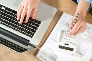 Accountant working with a calculator and computer